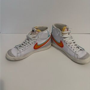 Nike White Sneakers with Red and Yellow Swoosh